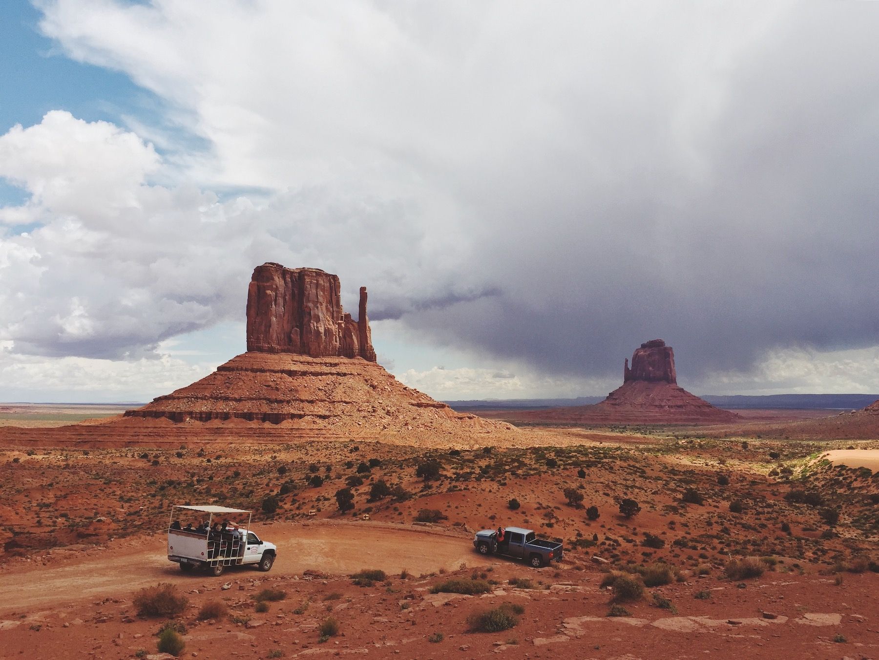 Red rocked desert, three stony brothers.