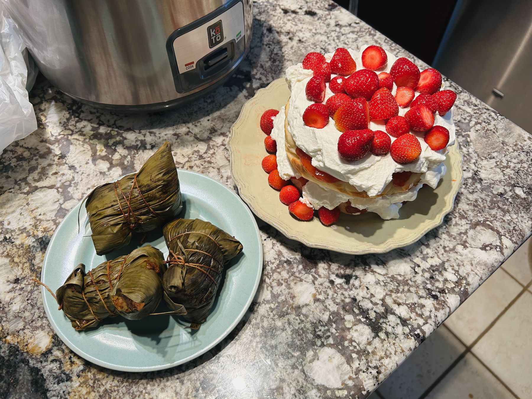 Zong zi plate next to Swedish strawberry cake