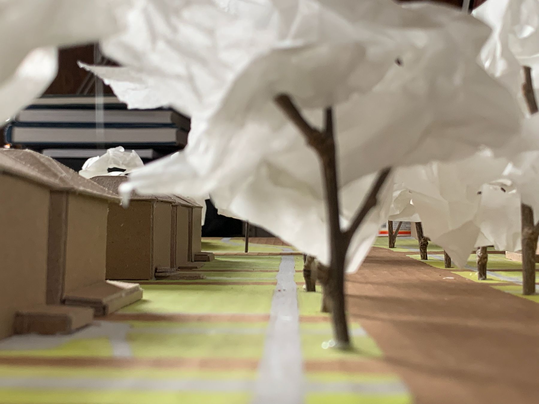 Looking down the sidewalk of a 1:200 model of a Detroit neighborhood. 