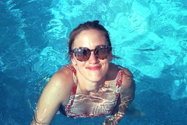 Julia coming out of the pool, all smiles.