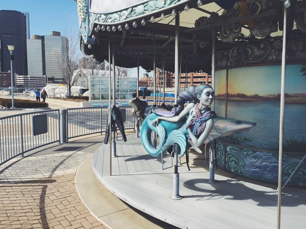 Mermaid seat on water-themed merry-go-round.