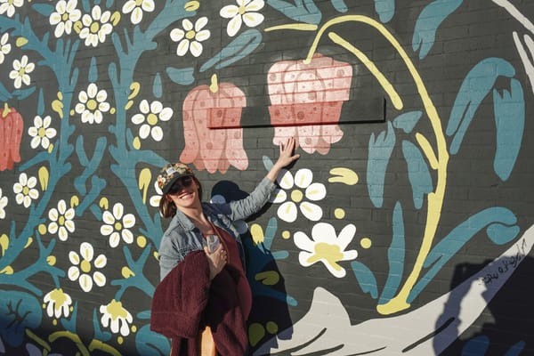 Julia thrilled to find a mural with her favorite flower, columbine, on the wall of our dinner spot.